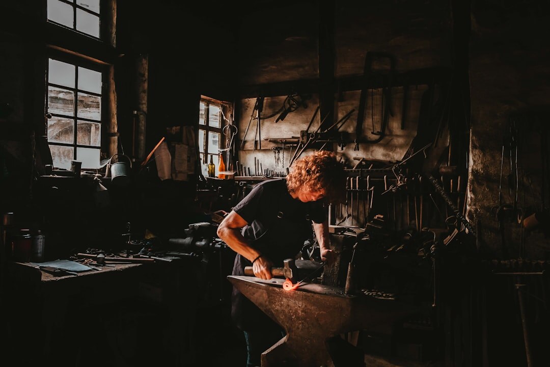 Photographer documenting a Danish craftsman working in his workshop
