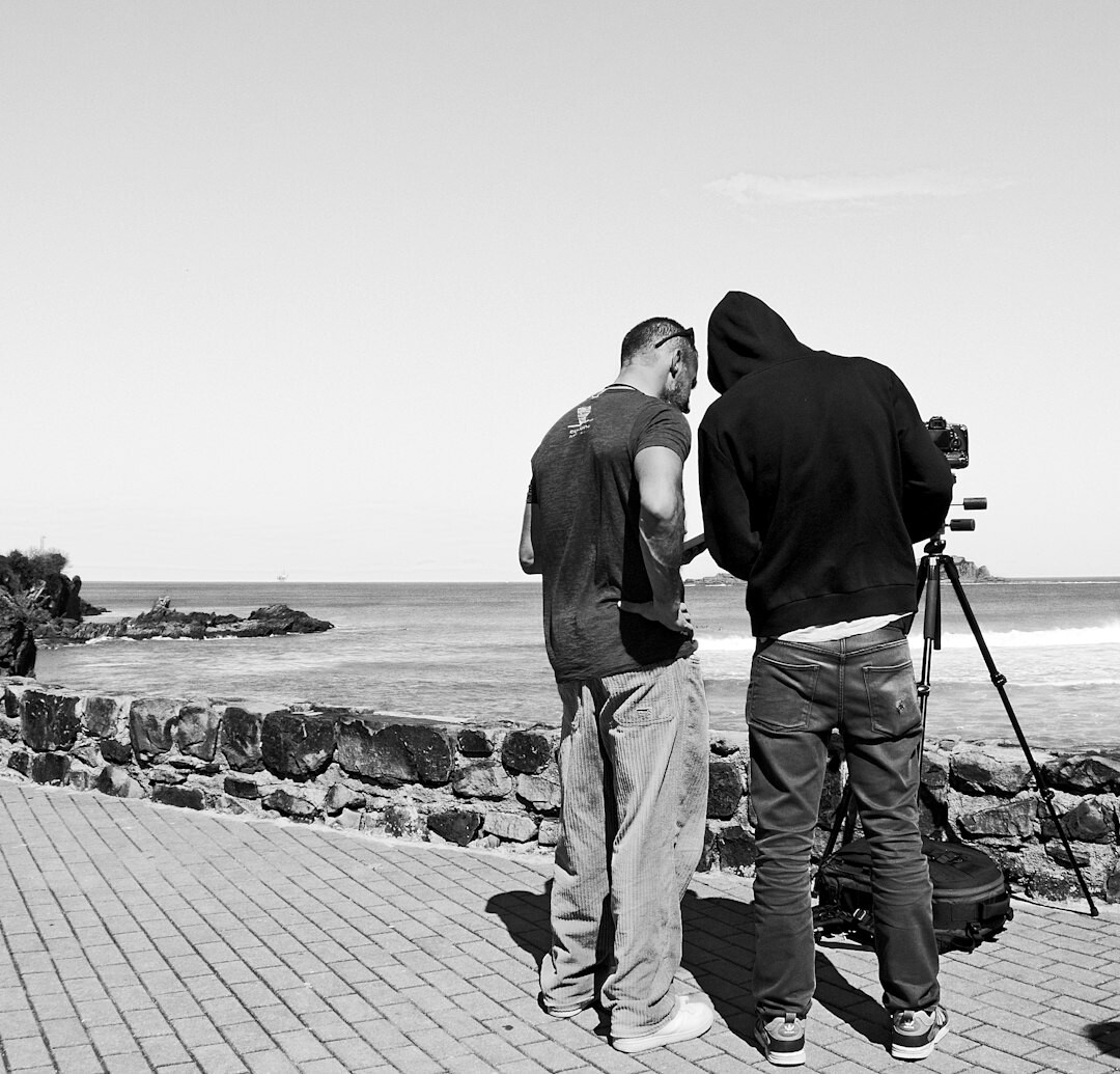 documentary photographer interviewing local hero